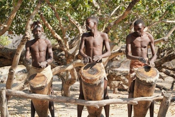 Tribe men playing their percussion instruments in Rundu, Kavango, Namibia. Photo by Datingjungle on Unsplash