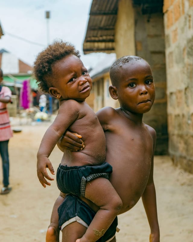 Two young children in an African village