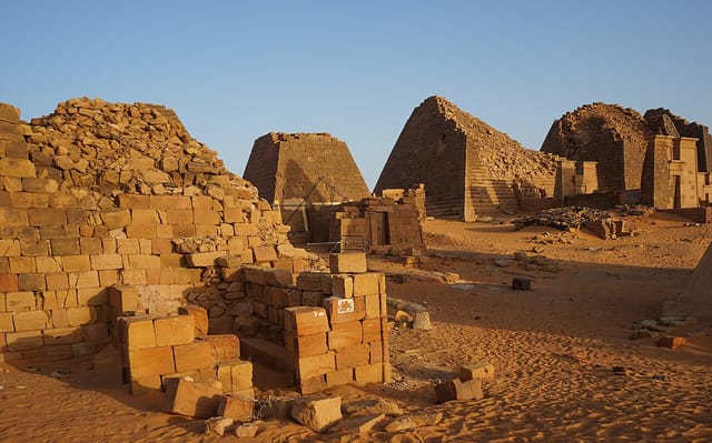 The steep Nubian pyramids of Meroe rising from the Sudanese desert.